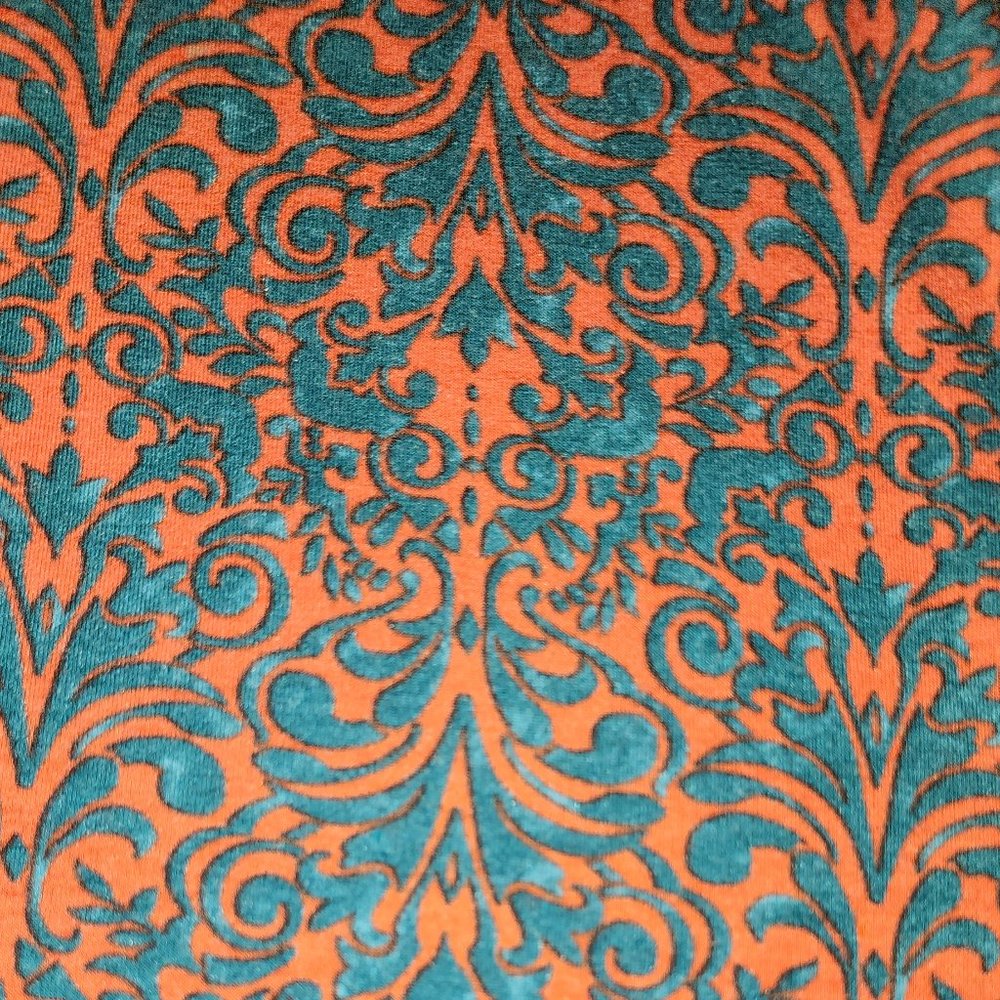Reddish/ orange? With turquoise design.